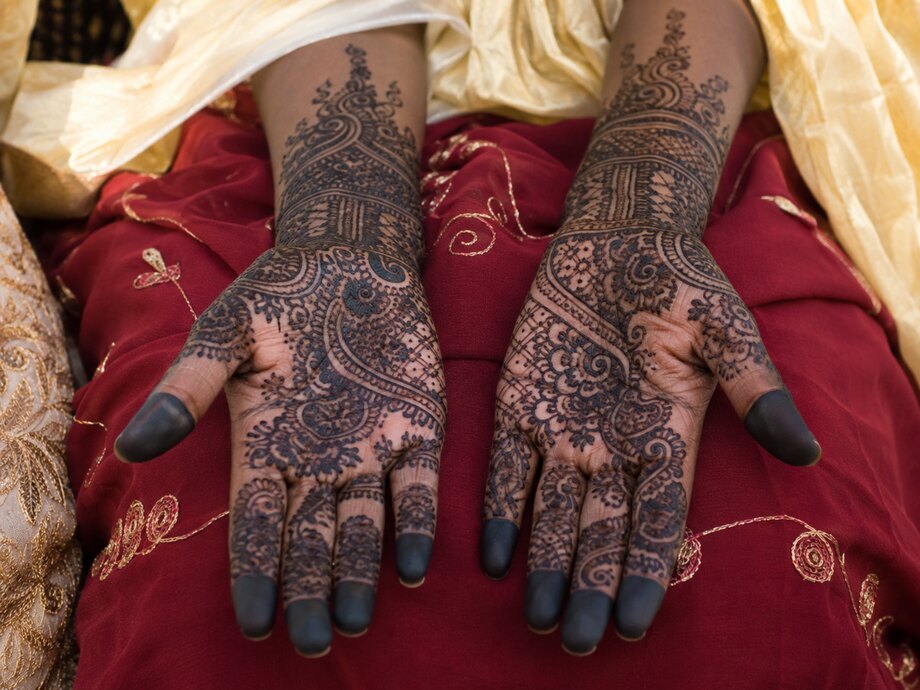 Bridal hands worked in black henna